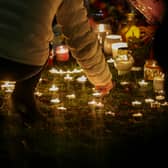 An organised candelit vigil at Babbs Mill Lake where a group of children fell through the ice on Sunday. Three of those children have died while a fourth, aged six, is fighting for his life in hospital.