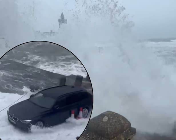 Waves soak car as Storm Kathleen batters British coast.