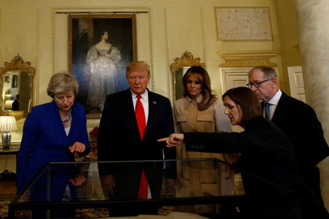 West Sussex County Archivist Wendy Walker delivered a presentation to President Donald Trump, Melania Trump, First Lady of the United States, Prime Minister Theresa May and her husband Philip May. Photo: HENRY NICHOLLS/AFP/Getty Images