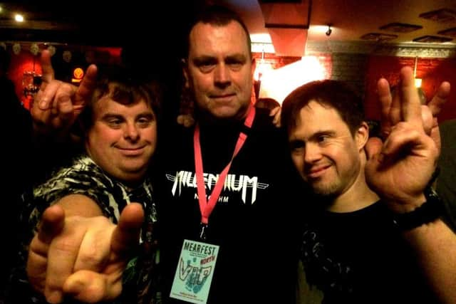 Brian with two people at the Mearfest rock festival in Newcastle last year