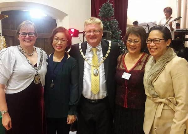 Both mayors are pictured with members of the Fil-Brit Association. Picture: Haywards Heath Town Council