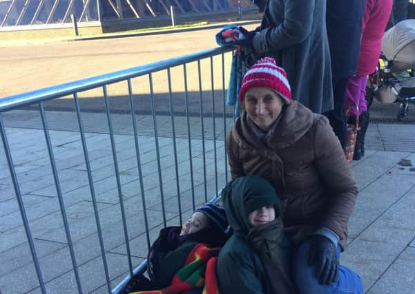 Vicky and her children Jonathan and Sophia patiently waiting