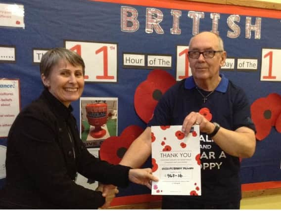 Headteacher Dawn Martin and British Legion Poppy coordinator Michael Elliott