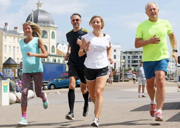 Clare Rixon, centre, with supporters of Marathon in a Day. Picture: Derek Martin DM17735585a