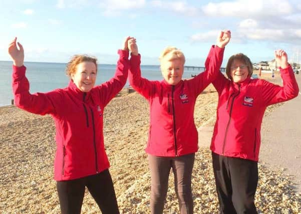 Julie Gillson, Jenny Hicklin and Margaret Murphy. Games Maker Choir, Bognor Regis Beach, Deecmber 2017. SUS-171112-103801003