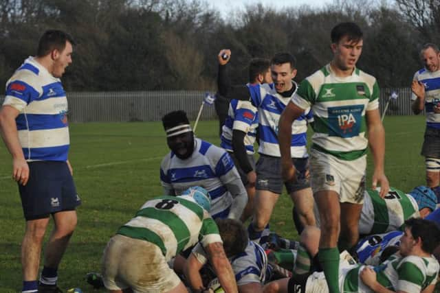 H&B celebrate after Anthony Roche scores their second try just before half time.