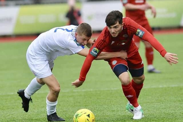 Jesse Starkey battles for the ball during Saturday's draw with Lowestoft Town. Picture by Stephen Goodger