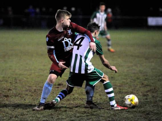 Luke Kilner battles for possession in Chi City's win at Horley on Saturday / Picture by Steve Robards