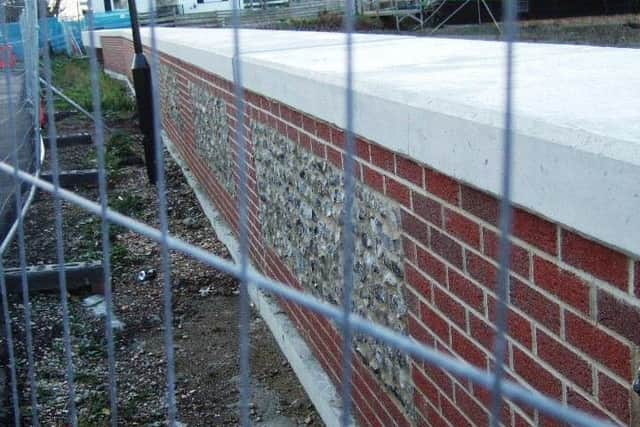 Brick and flint facing has been used to improve the look of the walls