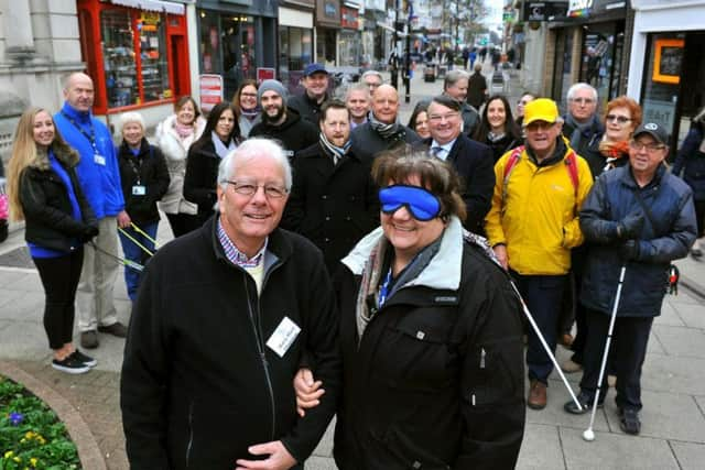 Barry Ward, chairman of Sight Support Worthing, guides Diane Guest, executive member for environment on Worthing Borough Council. Picture: Steve Robards SR1801674