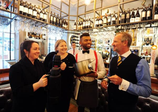 (From L to R) Zoe Bolt and Donna Ockenden, Four Streets volunteers, with barman Ally Abdul, and Purchases owner Tim Vaughan ks170025-1 SUS-180123-125017008