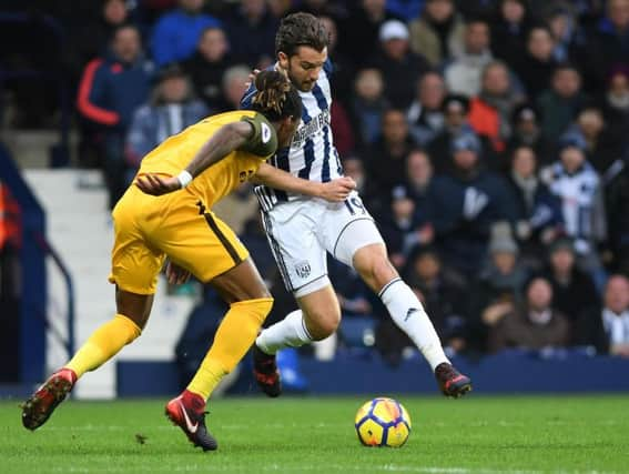 Gaetan Bong closes down Jay Rodriguez in the first half. Picture by Phil Westlake (PW Sporting Photography)