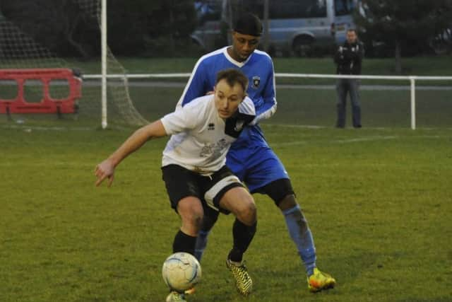 Gordon Cuddington holds off his marker.