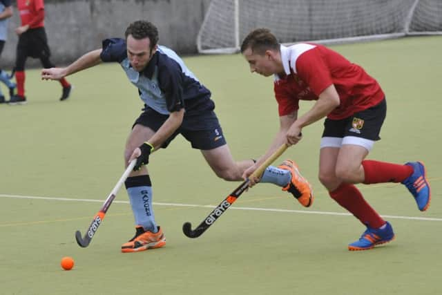 Gavin Cload tussles for possession.