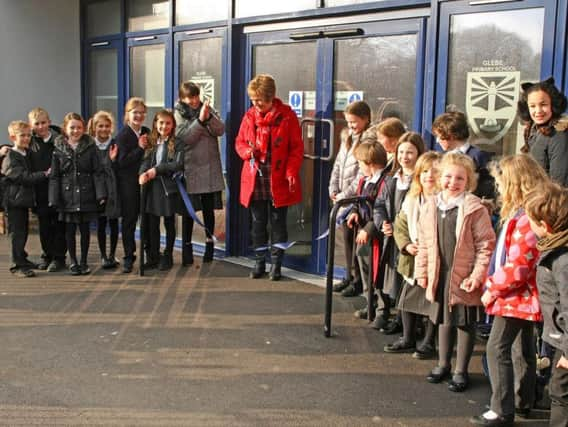 Shirley Osborne is applauded by head teacher Jo Kelly after cutting the ribbon to officially open the new extensions at Glebe Primary School. Pictures: Derek Martin DM1822902a