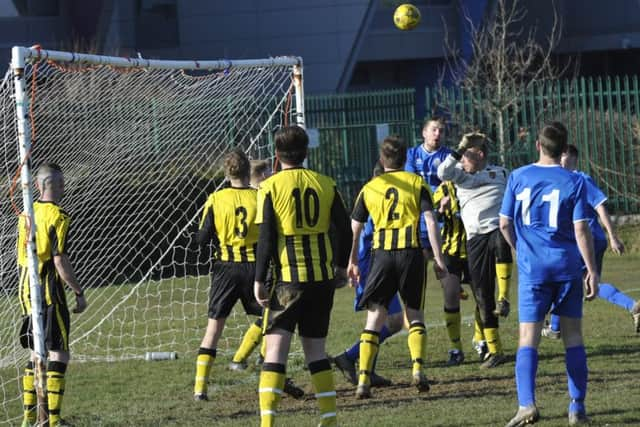 The heads go up at a Bexhill Rovers corner during their 2-0 defeat to Catsfield.