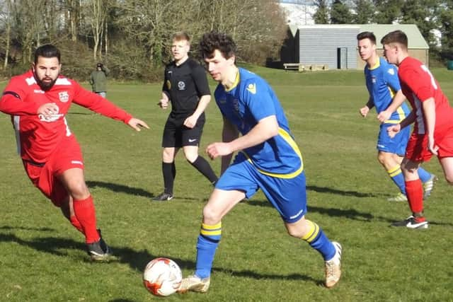 Sam Richardson on the ball for Rye Town during their 10-1 win away to Ore Athletic. Picture courtesy Paul Huggins