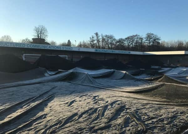 The covers at the Checkatrade.com Stadium covering the pitch before the Portsmouth game was postponed SUS-170123-202430002