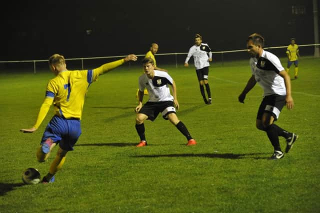 Action from the reverse fixture between Bexhill United and Langney Wanderers at the end of September. Picture by Simon Newstead