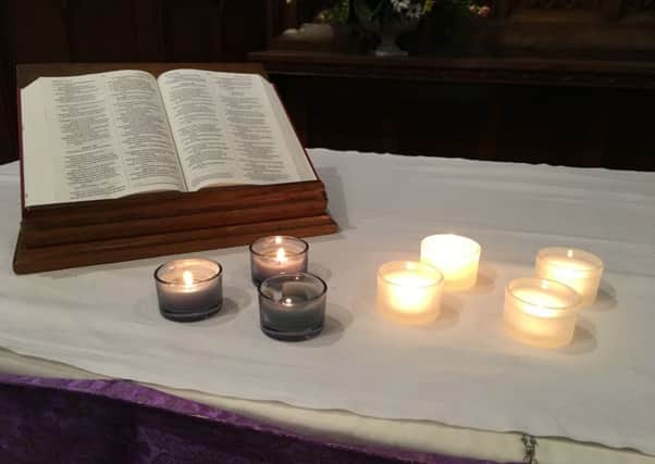 Candles lit for Jonathan and Ellie Udall, Becky Dobson, Stuart and Jason Hill, Jennifer Barham and pilot Scott Booth, those killed or injured in the Grand Canyon helicopter crash, at a prayer service in Worthing