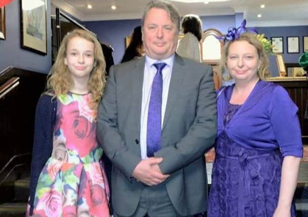 Robert Gosling with wife Emma and daughter Heather