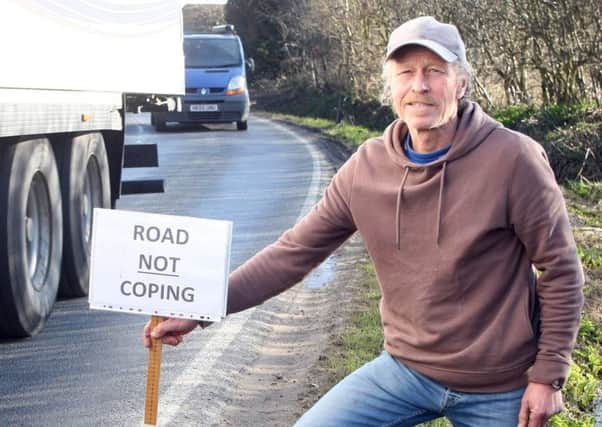 DM1831959a.jpg. Giles Binyon ran a DIY survey of Pagham Road and now county council have confirmed it will repair 300 metres of it. Photo by Derek Martin Photography. SUS-180313-175324008