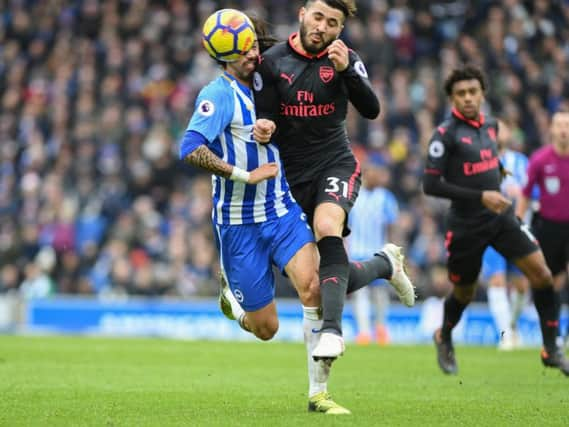 Ezequiel Schelotto collides with Sead Kolasinac on Sunday. Picture by Phil Westlake (PW Sporting Photography)