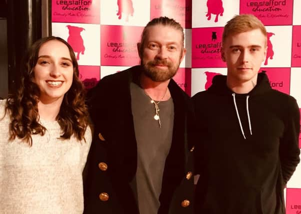 Jesse Courtney, far right, receiving his award from Lee Stafford, centre, with model, Chelsea, on the left