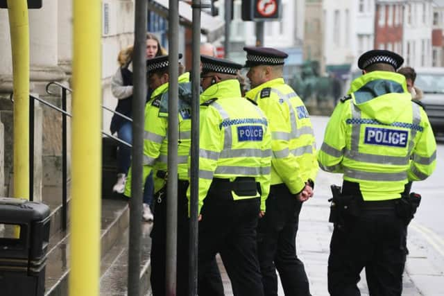 Police officers outside the court yesterday. Picture: Eddie Mitchell