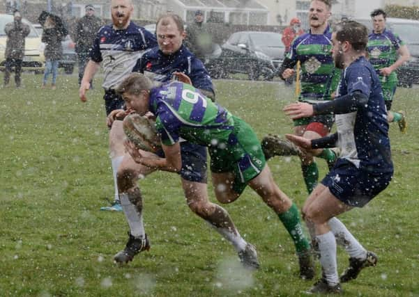 Jack Hornibrook battles through the snow againsst Ventnor / Picture by Kate Shemilt