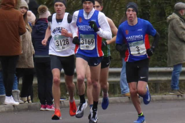 The leading quartet reach the top of Queensway in the sixth mile.