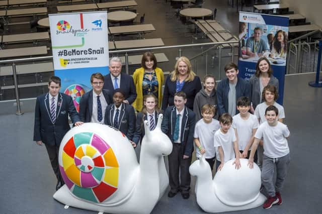 Students from Brighton Aldridge Community Academy (BACA) and Elm Grove Primary School (white T shirts), Sir Rod Aldridge and Imelda Glackin (Photograph: Liz Finlayson/Vervate)