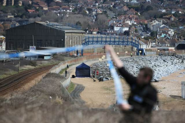 Police have closed off the beach while investigations continue. Photo by Eddie Mitchell. SUS-180504-130304001