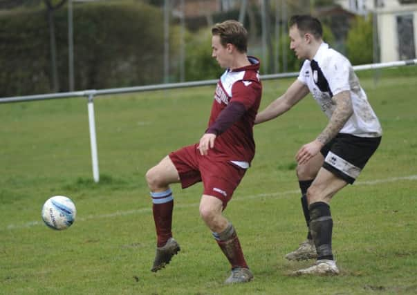 Sam Ellis tries to bring the ball under control during Little Common's 2-0 win away to Bexhill United on Monday. Picture by Simon Newstead