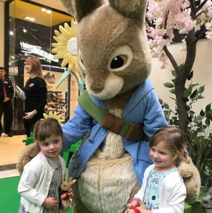 Molly and Lilly age 3.5 in awe of Peter Rabbit SUS-180604-142635001