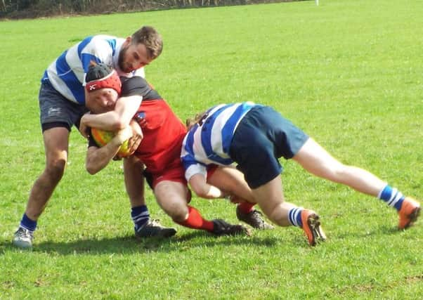 Hastings & Bexhill pair Jack James and Harry Walker combine to tackle a Park House player. Picture courtesy Peter Knight