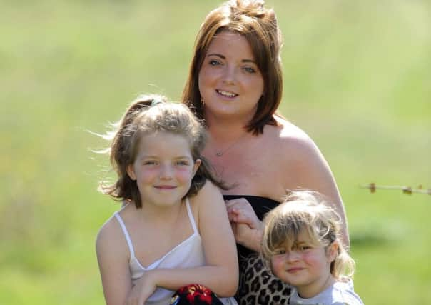 Mia Casey at home with her sister Poppy, three, and mum Jess      Picture:  Malcolm Wells (180420-1619)