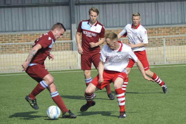 Harry Saville on the ball for Common.