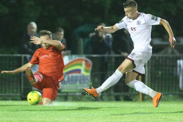 Davide Rodari scores Hastings United's opening goal in their 2-0 win against South Park. Picture courtesy Scott White