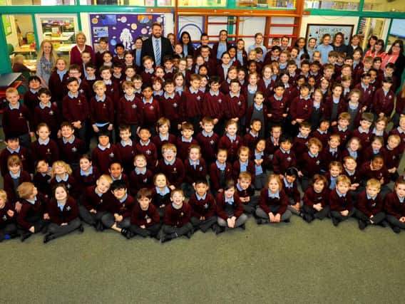 Staff and children at St Robert Southwell Catholic Primary School