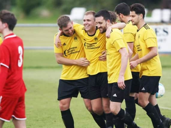 Littlehampton Town celebrate Mitchell Hand's goal on Saturday. Picture by Derek Martin