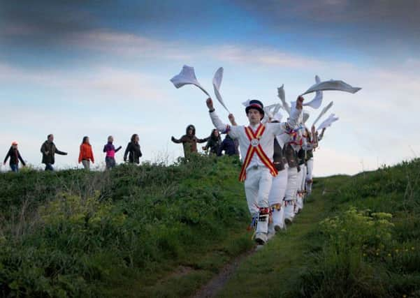 Dancing at Dawn, West Hill, Hastings. Photo by Kevin Boorman.

Three local sides, Mad Jacks Men, Mad Jacks Women, and Hannahs Cat, followed the tradition of dancing at dawn on May Day, on Ladies Parlour, against the historic backdrop of Hastings Castle. Starting at 0500, each side performed a number of dances, with the event finishing with a mass dance around the perimeter of Ladies Parlour. SUS-180105-085138001