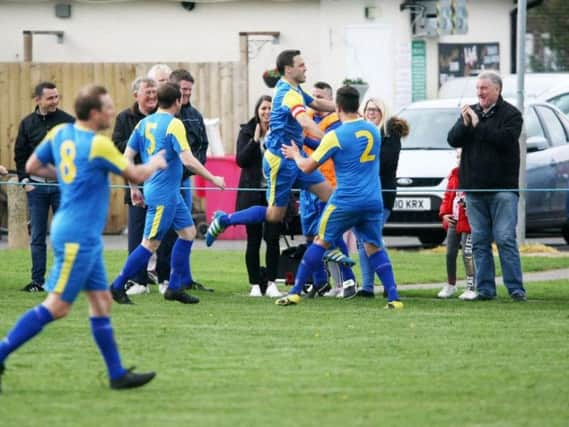 Rustington celebrate Steve Kirkham's goal in the win over Alfold. Picture by Derek Martin