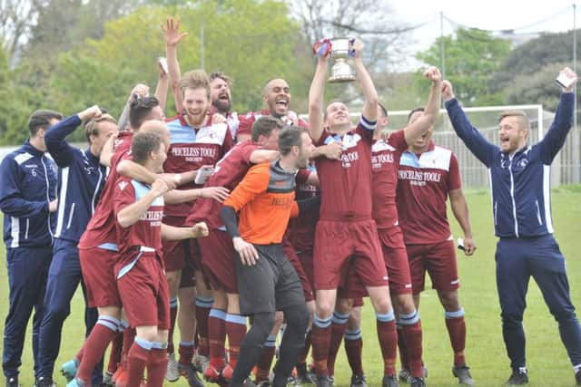 Little Common Football Club celebrates with the Macron Store Southern Combination League Division One trophy. Picture by Simon Newstead