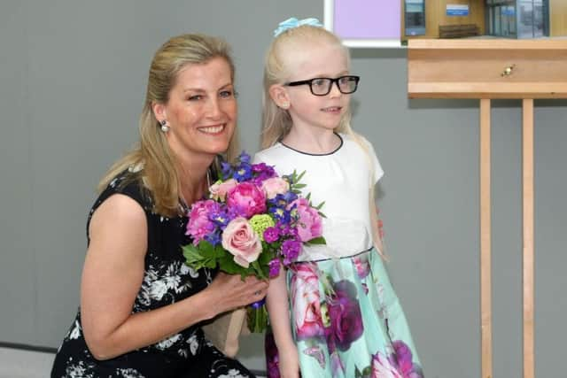 Receiving flowers from Sophia Mahony aged 6,. Photo by Derek Martin Photography. SUS-180805-155325008