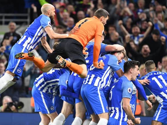 Brighton & Hove Albion players celebrate Pascal Gross' goal against Manchester United that secured their Premier League safety. Pictures by PW Sporting Photography