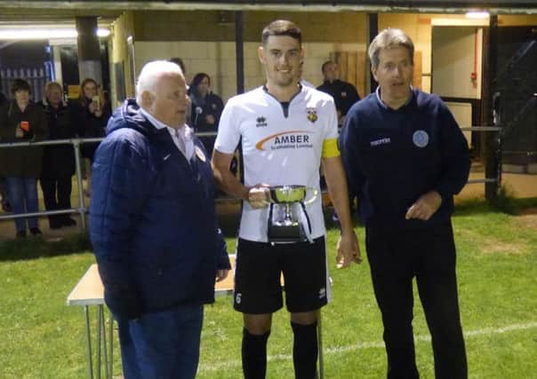 Reserves skipper Mike Gilchrist receives the trophy / Picture by Paul Davidson