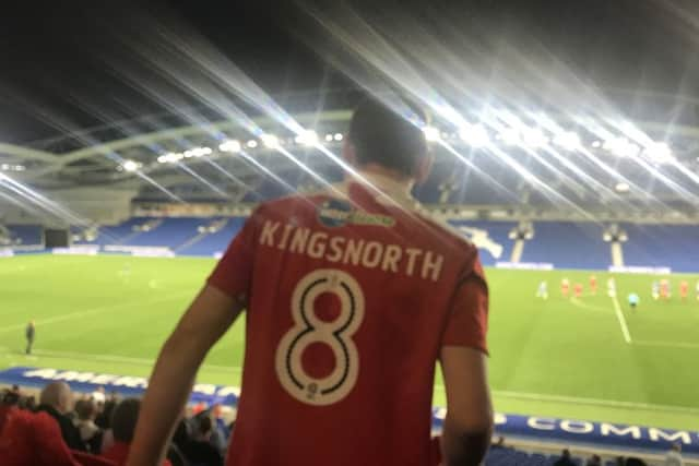 Young Crawley Town fan Jack Kingsnorth leading the singing at the Amex last week. Picture by Steve Herbert SUS-180514-100928002