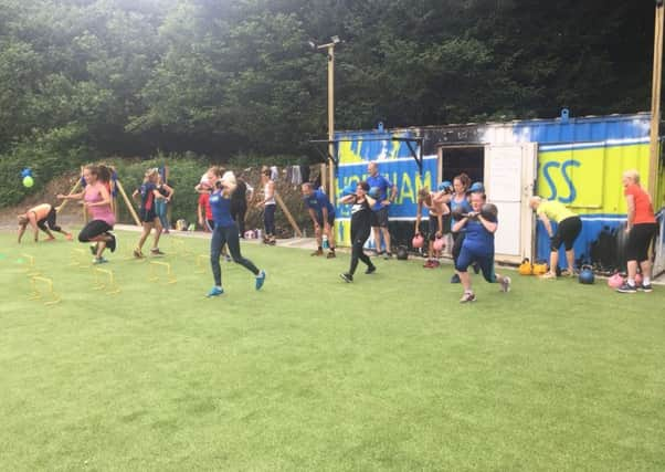 Members enjoy a workout in the new training zone