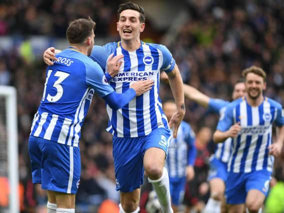 Lewis Dunk celebrates scoring against Arsenal. Picture by Phil Westlake (PW Sporting Photography)